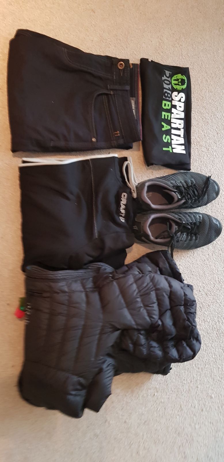 Jeans, a base layer, a down jacket and trail shoes
