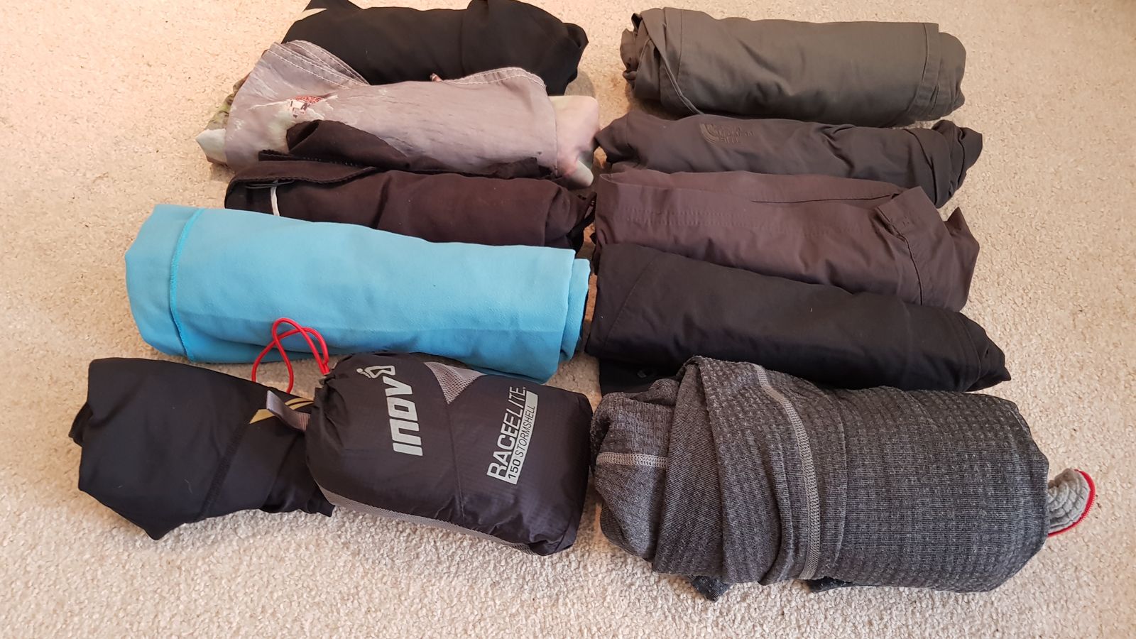 Trousers, a microfibre towel, a packable waterproof and a fleece