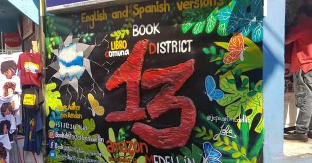 A brightly painted mural with a big red 13 and the words Book District.