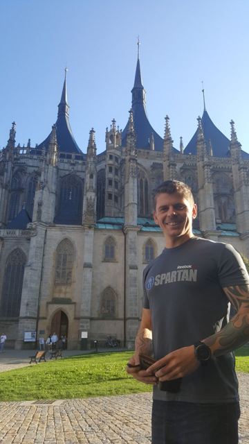 Dan in front of the Gothic spires of St Barbara's Cathedral in Kutná Hora