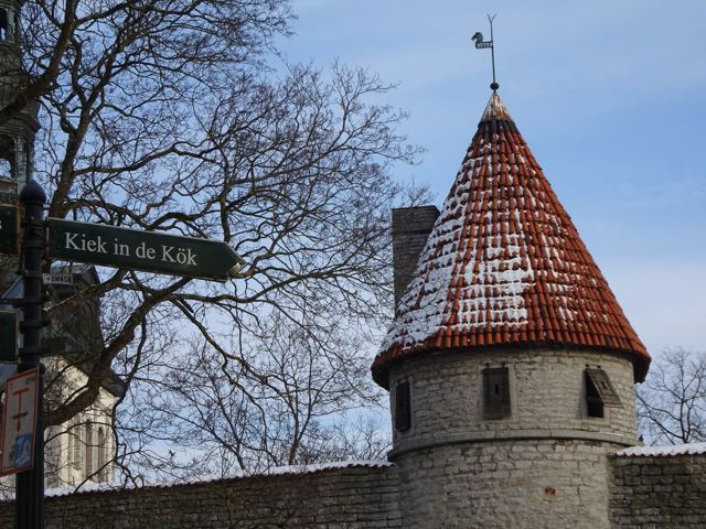A medieval stone tower of Tallinn's city wall above fresh snow