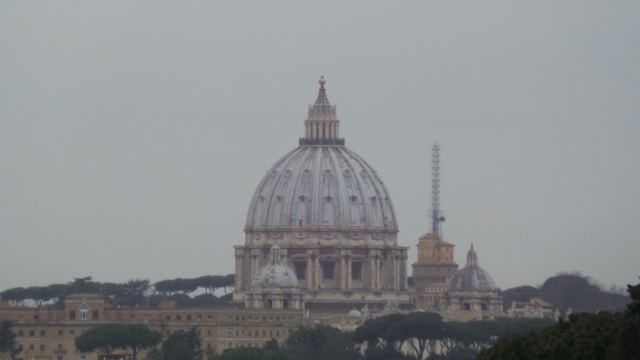 The dome of St Peter's rising above the rooftops.